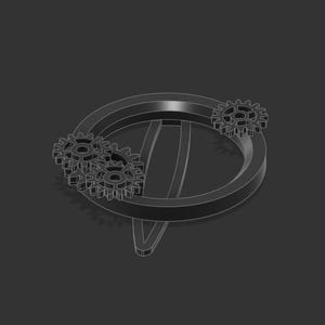 May include: A silver metal ring with three interlocking gears on the side. The ring is a circle with a flat surface and a raised edge.