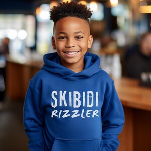 Skibidi Rizzler Youth Size Hoodie, Trendy Hoodie, Gift for Boys, Gift for Girls, Meme Sweater, Skibidi Sigma, Gyat, Gen Alpha, wht ltr