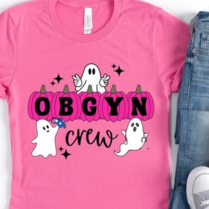 Trendy Pink OBGYN Crew Halloween Retro Ghost & Pumpkin Shirt for Obstetrics and Gynecology Hospital Staff/Squad/Team/Unit. Cute Spooky Tee.