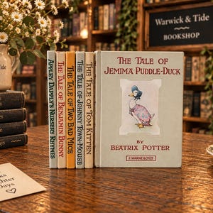 May include: A collection of Beatrix Potter books including The Tale of Jemima Puddle-Duck, The Tale of Tom Kitten, The Tale of Johnny Town-Mouse, The Tale of Two Bad Mice, The Tale of Benjamin Bunny, and Appley Dapply's Nursery Rhymes with spines visible.