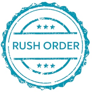 May include: A teal-colored, distressed-style stamp with the words "RUSH ORDER" in bold, sans-serif font. The stamp has a scalloped edge and includes three stars above and below the text, set against a white background.