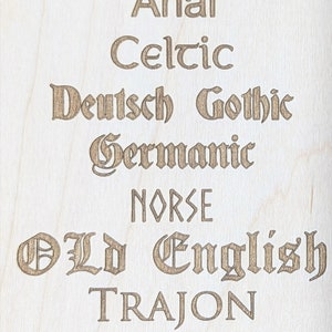 May include: A wood panel with the text "Standard Fonts" at the top. The panel lists various font names in a decorative style, including Arial, Celtic, Deutsch Gothic, Germanic, Norse, Old English, Trajon, and Viking.