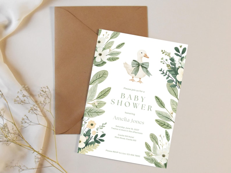 Puede incluir: Una invitaci&oacute;n para baby shower con una ilustraci&oacute;n en acuarela de un ganso con un lazo verde, rodeado de elementos florales. La invitaci&oacute;n incluye el texto "Baby Shower" y los detalles de la fiesta de Amelia Jones.