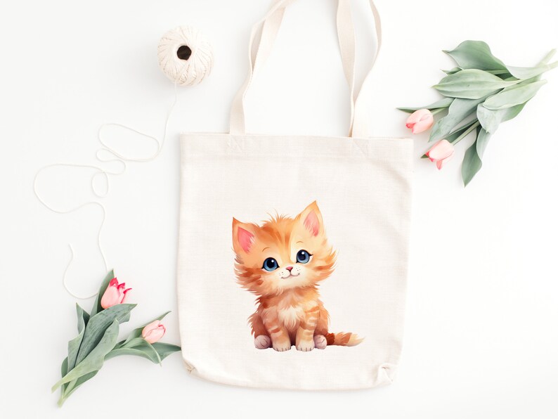 May include: A white canvas tote bag with a cute orange kitten illustration. The kitten has blue eyes and is sitting on its hind legs with its front paws raised.