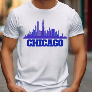 May include: White t-shirt with a blue silhouette of the Chicago skyline and the word "CHICAGO" in blue letters.