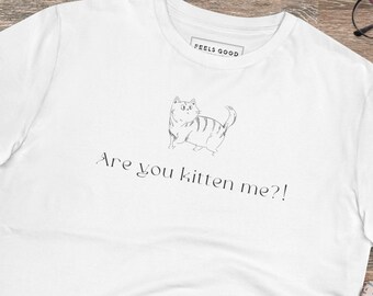 May include: White t-shirt with a black and white illustration of a cat and the text "Are you kitten me?" printed on the front.