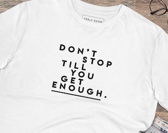 May include: White t-shirt with black text that reads "DON'T STOP TILL YOU GET ENOUGH."