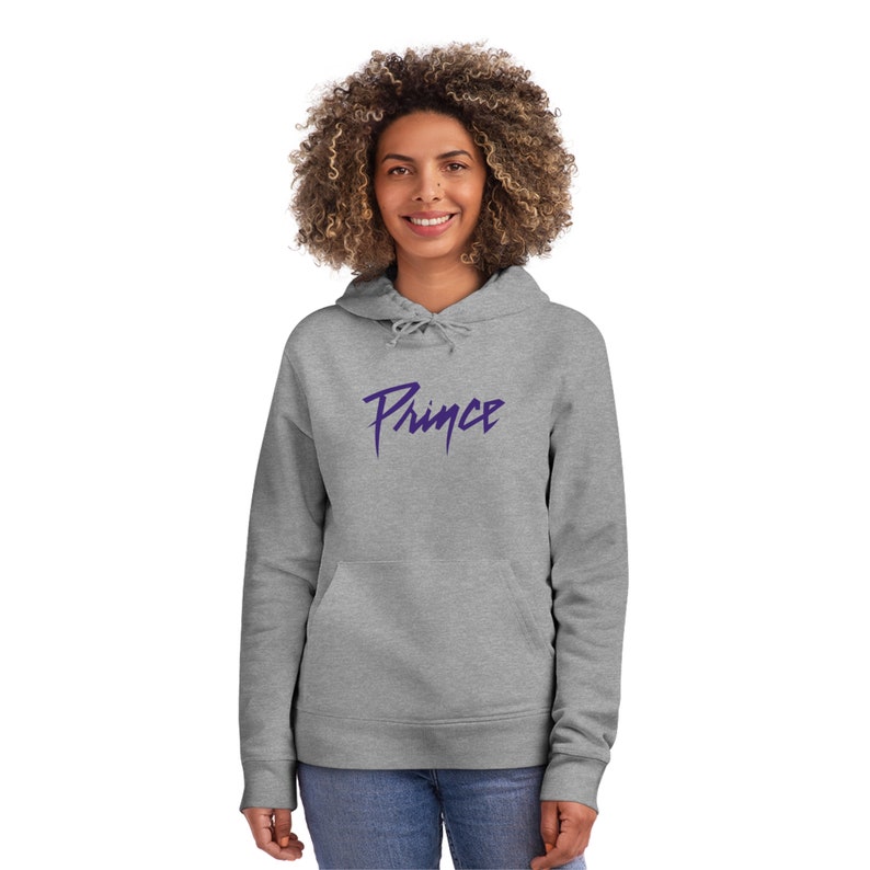 May include: A grey hooded sweatshirt with a purple "Prince" logo printed on the front.