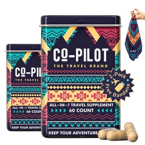 May include: Two blue and yellow patterned metal tins with the text "CO-PILOT THE TRAVEL BRAND" and "ALL-IN-1 TRAVEL SUPPLEMENT 60 COUNT" on the front. The tins are stacked on top of each other. There are three brown capsules in front of the tins. A blue bandana with the text "CO-PILOT" is in the upper right corner of the image.