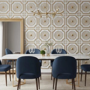 May include: A dining room with a marble-topped table and six navy blue chairs. The room features a decorative gold and white patterned wallpaper and a gold-framed mirror. A chandelier hangs above the table. The room is carpeted.