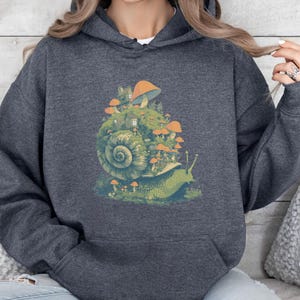 Whimsical Snail with Small Village and Mushrooms, Goblincore Hoodie, Nature Lover Gift, Forest Creature Tee, Magical Woodland Hoodie,