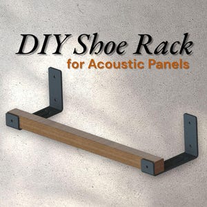 May include: DIY shoe rack for acoustic panels. The shoe rack has a wooden shelf supported by two dark grey metal brackets. The text "DIY Shoe Rack for Acoustic Panels" is displayed in black and orange.