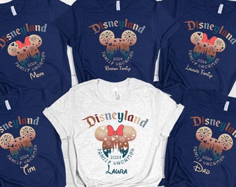 May include: Five navy blue t-shirts with a white Mickey Mouse silhouette and the text "Disneyland Family Vacation 2024" on the front. The shirts have different names printed below the text, including "Mom", "Tim", "Dad", "Laura's Family", and "Brown Family".