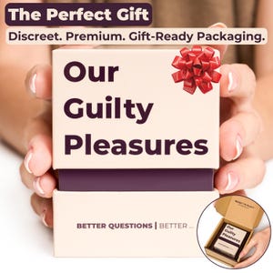 Hands holding the beige Our Guilty Pleasures card game box with a dark purple center and a red gift bow on top, showing the front of the packaging with "Our Guilty Pleasures" printed clearly. The image depicts the card game as "The Perfect Gift".