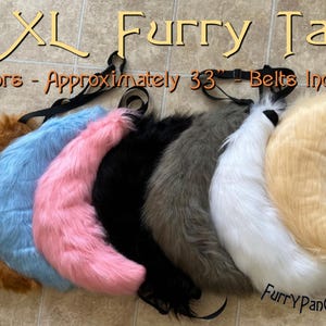 May include: Seven XL furry tails in a variety of colours, including brown, blue, pink, black, grey, white, and beige. Each tail is approximately 33 inches long and includes a belt.