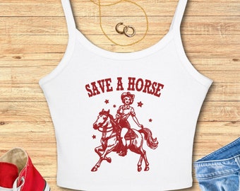 May include: White tank top with a red graphic of a woman riding a horse. The graphic says "Save a Horse".