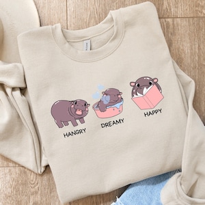 Sweat-shirt pygmée hippopotame livresque, col rond bébé python hippopotame, sweat-shirt lecture, pull hippopotame lecture, chemise humeurs de lecture, cadeau livresque