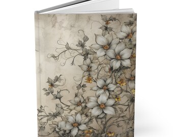 May include: A vintage-style journal with a floral design. The cover features a light brown background with a pattern of white flowers and vines. The flowers have a delicate, hand-drawn look and are accented with small yellow details.