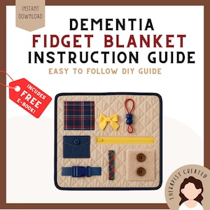 May include: A square beige quilted fidget blanket with a dark blue border. Features include a plaid square, yellow bow, red loop with blue beads, yellow zipper, blue pocket with button, blue buckle strap, braided cord, and two brown buttons on a fuzzy patch.