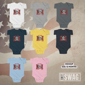 May include: A set of ten baby onesies in various colours, each featuring a skull graphic and the text "Goth Music Kraken's Got Me On Lockdown". The onesies are arranged in two rows of five, with a white background.