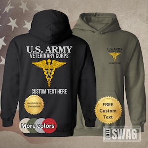 May include: Black and olive green hooded sweatshirt with a gold U.S. Army Veterinary Corps logo and the text "U.S. ARMY VETERINARY CORPS" and "CUSTOM TEXT HERE".