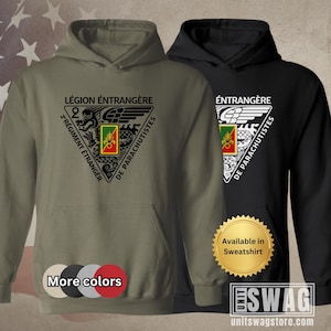 May include: Two hooded sweatshirts, one olive green and one black, featuring a triangular emblem with text in French. The emblem includes a dragon, wings, and the words "Légion Étrangère" and "2e Régiment Étranger de Parachutistes". Additional color options are displayed.