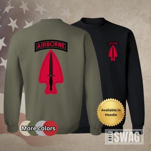 May include: Two sweatshirts, one olive green and one black, each featuring a red and black Airborne patch with a dagger design. The olive green sweatshirt has "More colors" text. The black sweatshirt has "Available in Hoodie" text and "UNIT SWAG" text.