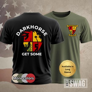 May include: Black t-shirt with a white graphic of a logo that says "DARKHORSE GET SOME". The logo is a circle with four sections, each with a different color and design. The t-shirt is available in long sleeve.