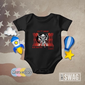 May include: Black baby grow with a red and white graphic of a kraken with the text "197th MRBC KRAKENS GET 'EM ACROSS".