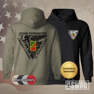 May include: Two hoodies, one olive green and one black, featuring a military emblem with text in French. The olive green hoodie displays the emblem on the back, while the black hoodie has it on the chest. The text reads "LÉGION ÉTRANGÈRE" and "2 RÉGIMENT ÉTRANGER DE PARACHUTISTES".