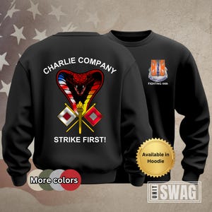 May include: Black sweatshirt with a red, white, and blue cobra graphic, the words "Charlie Company" and "Strike First!" and a patch with the words "Outstanding Fighting 44th".