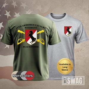 May include: A green t-shirt with the text "11th Armored Cavalry Regiment Blackhorse" and a black horse graphic. The t-shirt is available in long sleeve.