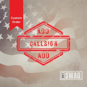 May include: Red distressed rubber stamp with the text "ADD CALLSIGN ADD" on a white and red American flag background. The text "UNIT SWAG" is in a red rectangle in the lower right corner.