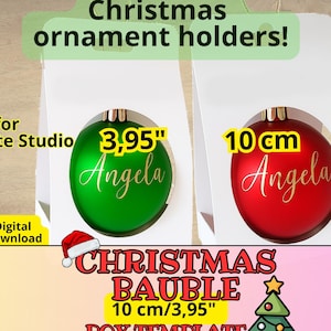 Puede incluir: Plantilla digital de caja de bolas de Navidad. La imagen muestra una bola de Navidad verde y una roja, cada una con el nombre "Angela" en escritura dorada. El adorno verde mide 10 cm de diámetro, y el rojo mide 10 cm de diámetro.