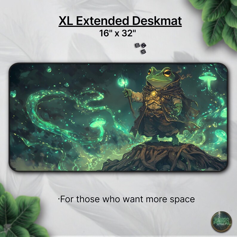 May include: XL extended deskmat, 16 x 32 inches, featuring a green frog wizard with a staff, set against a dark green and black background with glowing green accents. Text reads "For those who want more space."