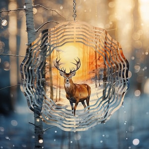 May include: A metal wind spinner with a deer silhouette in a forest scene. The deer is brown and has antlers. The background is a watercolor-style painting of a forest with a sunset in the background.