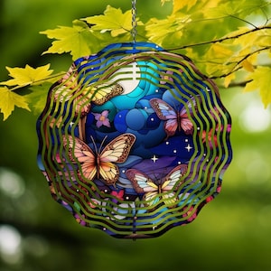 May include: A metal wind spinner with a blue, purple, and green design featuring butterflies and stars. The spinner is designed to rotate in the wind.