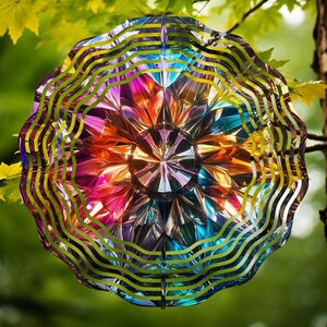 May include: A colorful, iridescent wind spinner with a geometric design. The spinner has a layered, multi-dimensional look with a central hub and radiating spokes. The colors are vibrant and include shades of red, orange, yellow, green, blue, and purple.