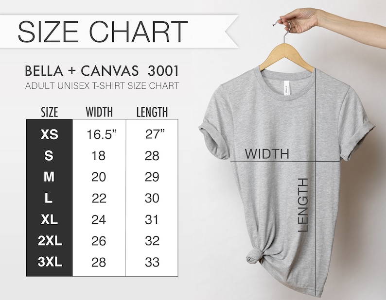 May include: A light gray Bella + Canvas 3001 adult unisex t-shirt hanging on a wooden hanger. The image includes a size chart with measurements in inches for XS to 3XL sizes. The chart shows width and length measurements.