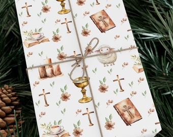 May include: White wrapping paper with a repeating pattern of religious imagery, including crosses, chalices, a lamb, and a bible. The paper is tied with a brown twine bow.