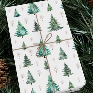 May include: A white gift wrap with a repeating pattern of green watercolor pine trees and brown branches. The gift wrap is tied with a brown twine bow.