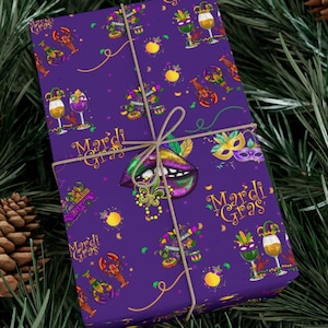 May include: Purple wrapping paper with a Mardi Gras theme. The paper features a repeating pattern of gold beads, masks, jester hats, wine glasses, lobsters, and the words "Mardi Gras".