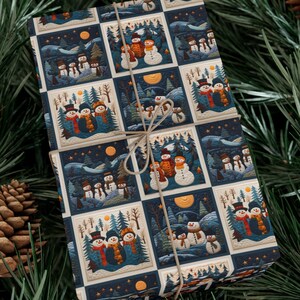 May include: A blue and white wrapping paper with a repeating pattern of snowmen in winter scenes. The snowmen are wearing hats and scarves and are surrounded by trees and stars.