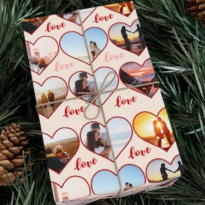 May include: A cream-colored wrapping paper with a repeating pattern of red hearts and photos of couples. The hearts have a red beaded border and the word "love" is written in red cursive inside each heart.