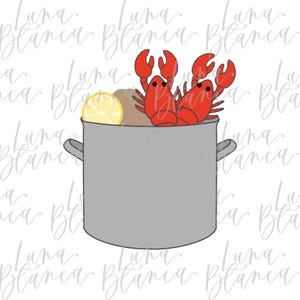 May include: A gray pot filled with red lobsters, potatoes, and a lemon slice. The pot has two handles and is set against a white background. The text "Luna Blanca" is repeated across the image.