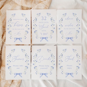 Dusty Blue Floral Bridal Shower Sign Bundle, Wildflower Love In Bloom Kokietka Bow Set Decor, Tabliczka na stół, Edytowalny szablon Canva
