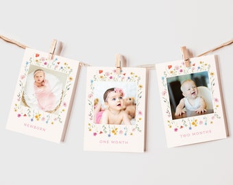 May include: A set of three cards with floral borders and photos of a baby at different ages. The cards are labeled "Newborn", "One Month", and "Two Months".