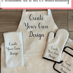 May include: A white kitchen set including an apron, oven mitt, pot holder, and towel. Each item features the text "Create Your Own Design" in a stylish script. The set is available to purchase individually or as a set.