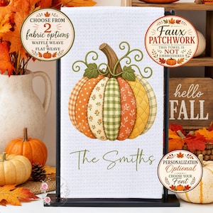 May include: A white waffle weave kitchen towel featuring a central faux patchwork pumpkin graphic with orange, green, and yellow patterns. The text "The Smiths" is printed below the pumpkin. The towel includes circular labels noting fabric options and personalization.