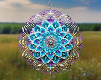 May include: A decorative wind spinner with a mandala design. The spinner features a central turquoise and blue floral pattern, surrounded by purple and silver wavy edges. It hangs from a silver hook, suitable for outdoor decor.